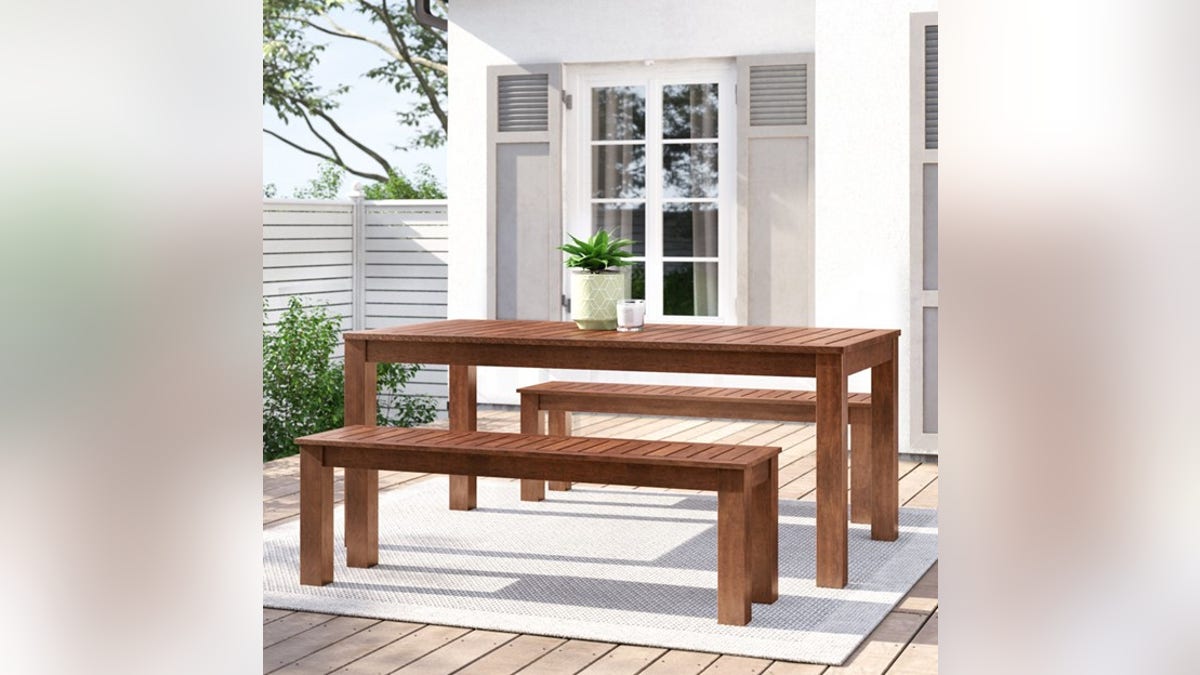This wood outdoor dining table is durable and comfortable.