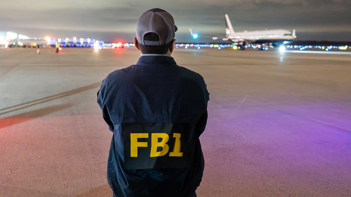 FBI Director Kash Patel is awaiting Muhammed Sharifullah's extradition flight.