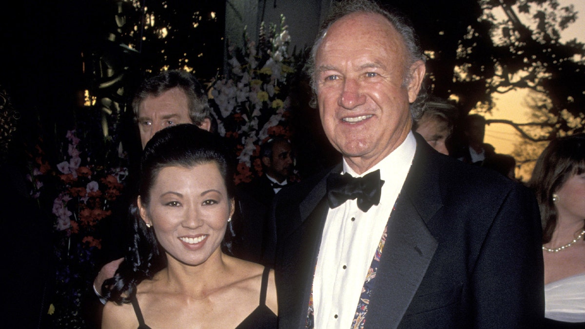 Gene Hackman and Betsy Arakawa smile