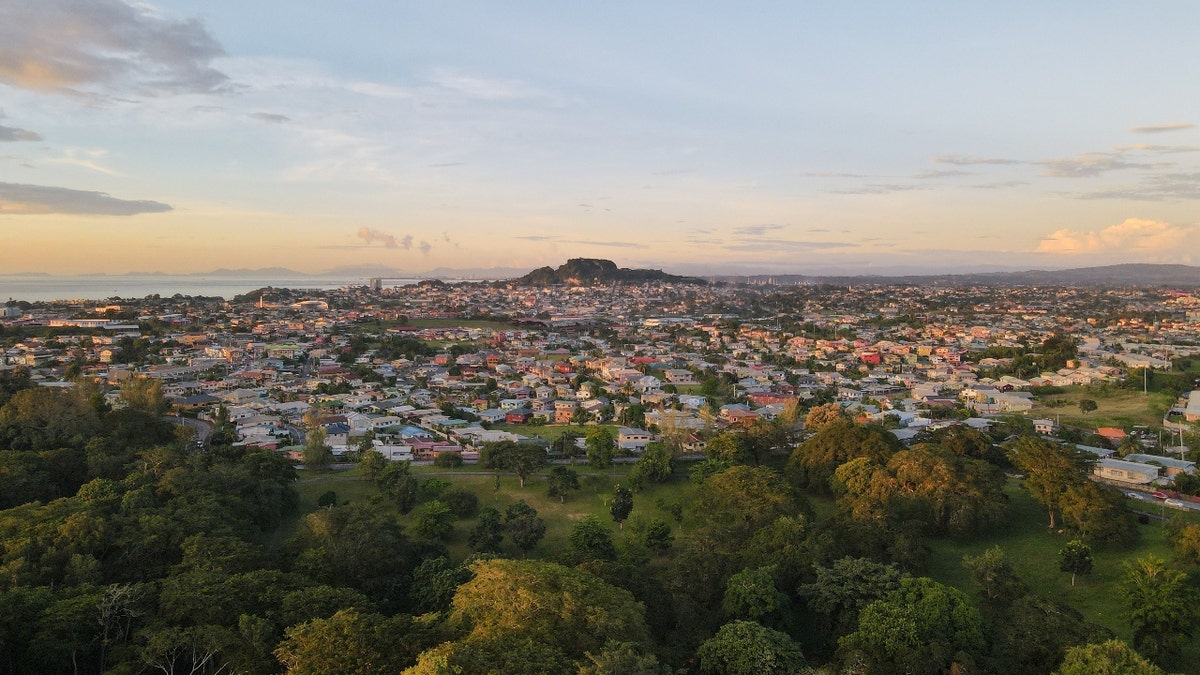 An aerial view of the cityscape of San Fernando against the dusk sky at sunset in Trinidad and Tobago