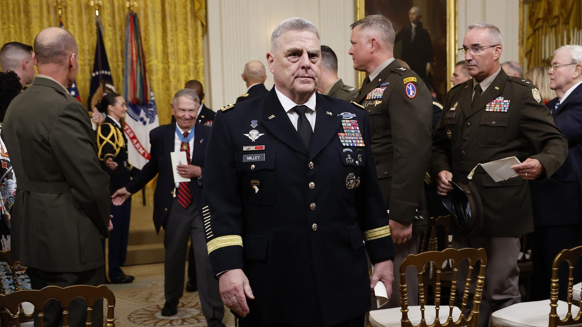 Chairman of the Joint Chiefs of Staff Mark Milley (C) departs the Medal of Honor ceremony for retired U.S. Army Captain Larry Taylor in the East Room of the White House on September 05, 2023 i