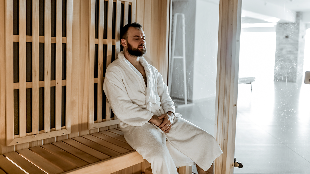 man sitting in a sauna