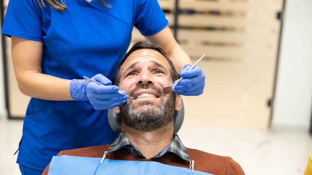 Man looks stressed at dentist