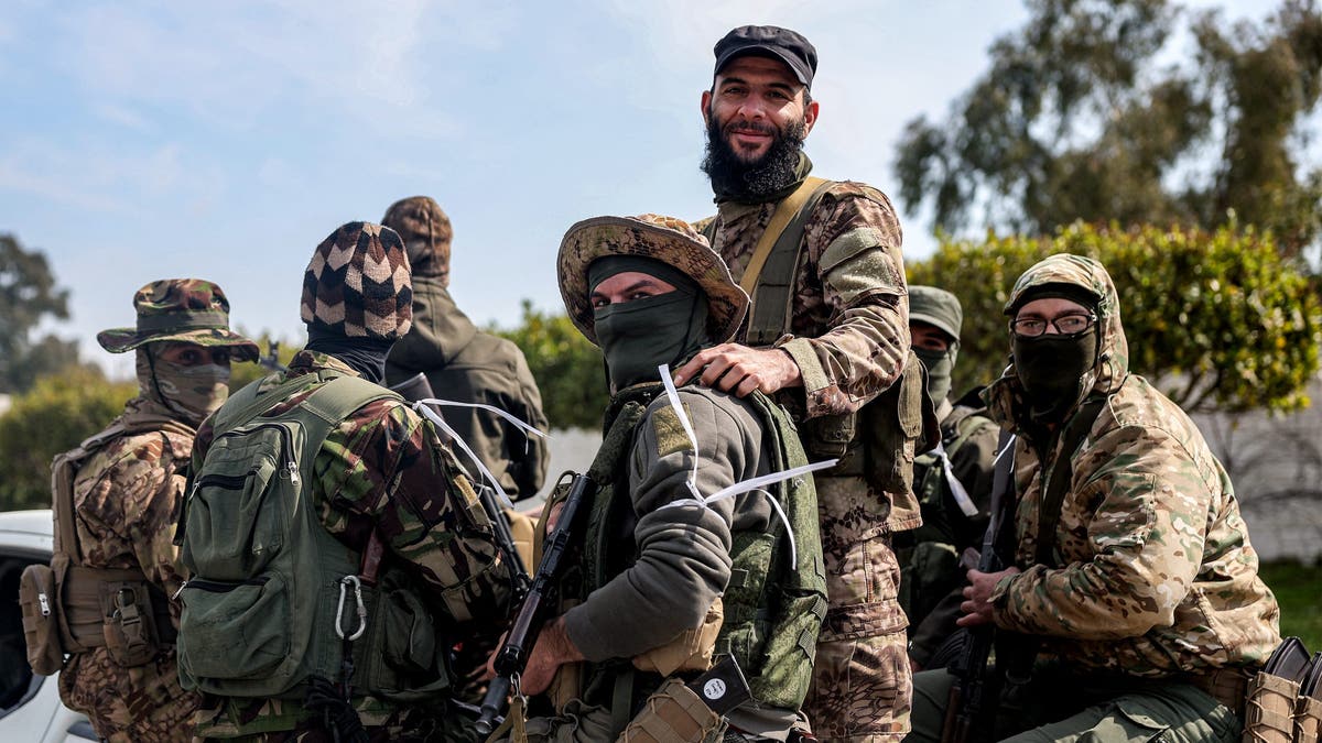 A fighter jet loyal to the interim Syrian government is depicted.