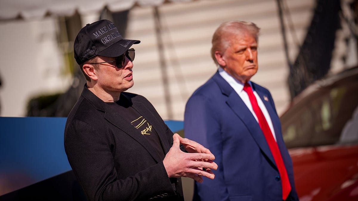 Musk and Trump outside the White House with the Red Tesla