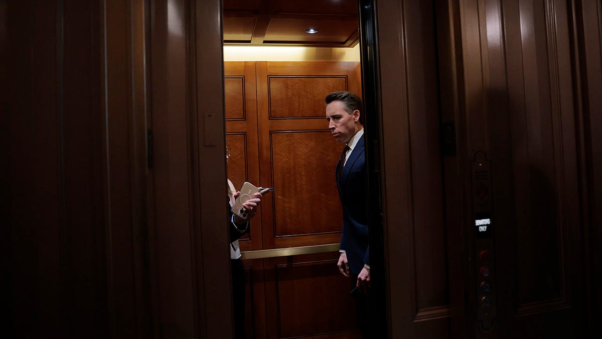 Hawley enters an elevator at the Capitol