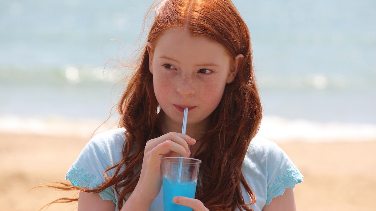 Girl drinking slushy