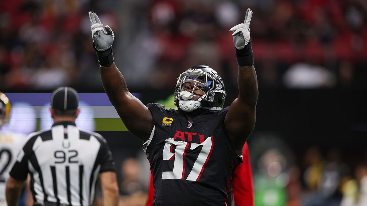 Grady Jarrett points up on field