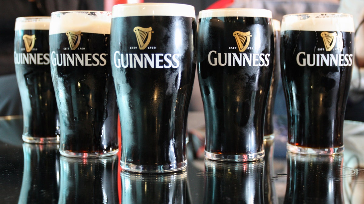 Guinness's cups line up.