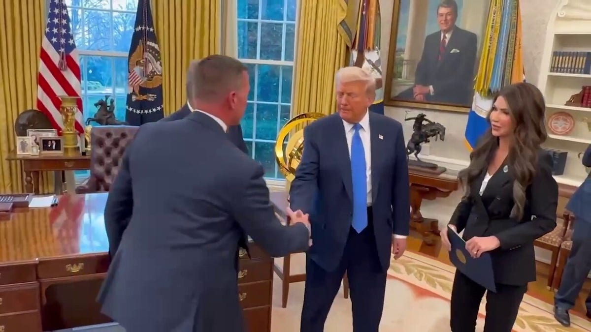 Sean Curran shakes hands with President Trump