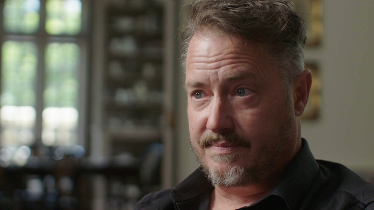 A close-up of Jeremy London looking away from the camera.