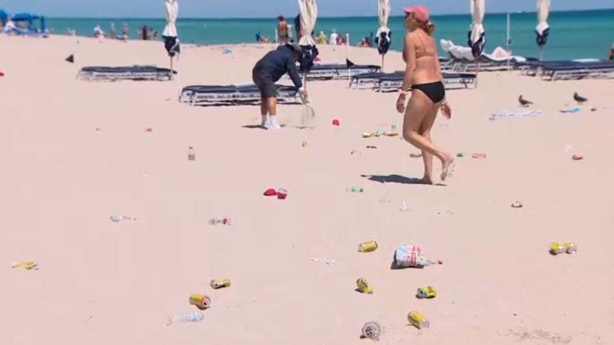 Beach cleanup after an unpermitted gathering was dispersed in Sunny Isles on Friday, March 21.