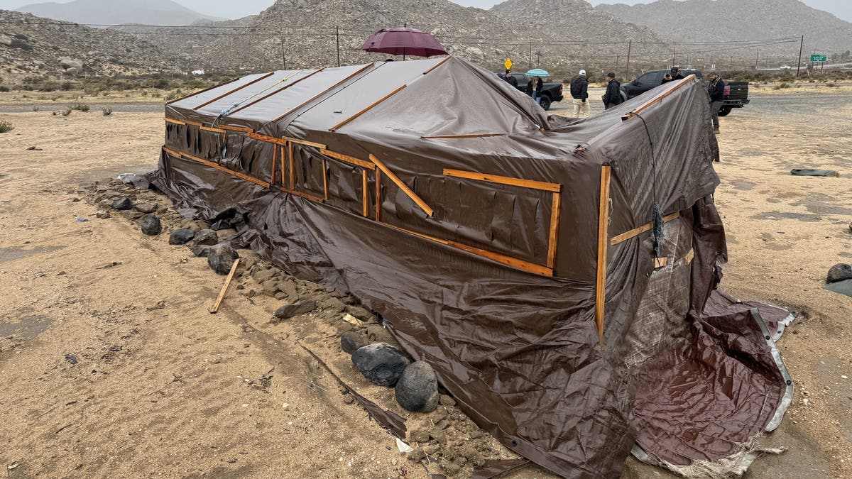 makeshift shelter in desert near border