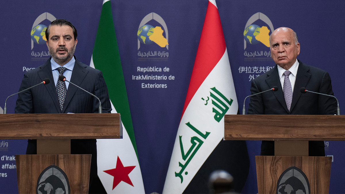 Syrian Foreign Minister Ashaybani Asaad, left, speaks during a press conference with his Iraqi counterpart Foud Hussein