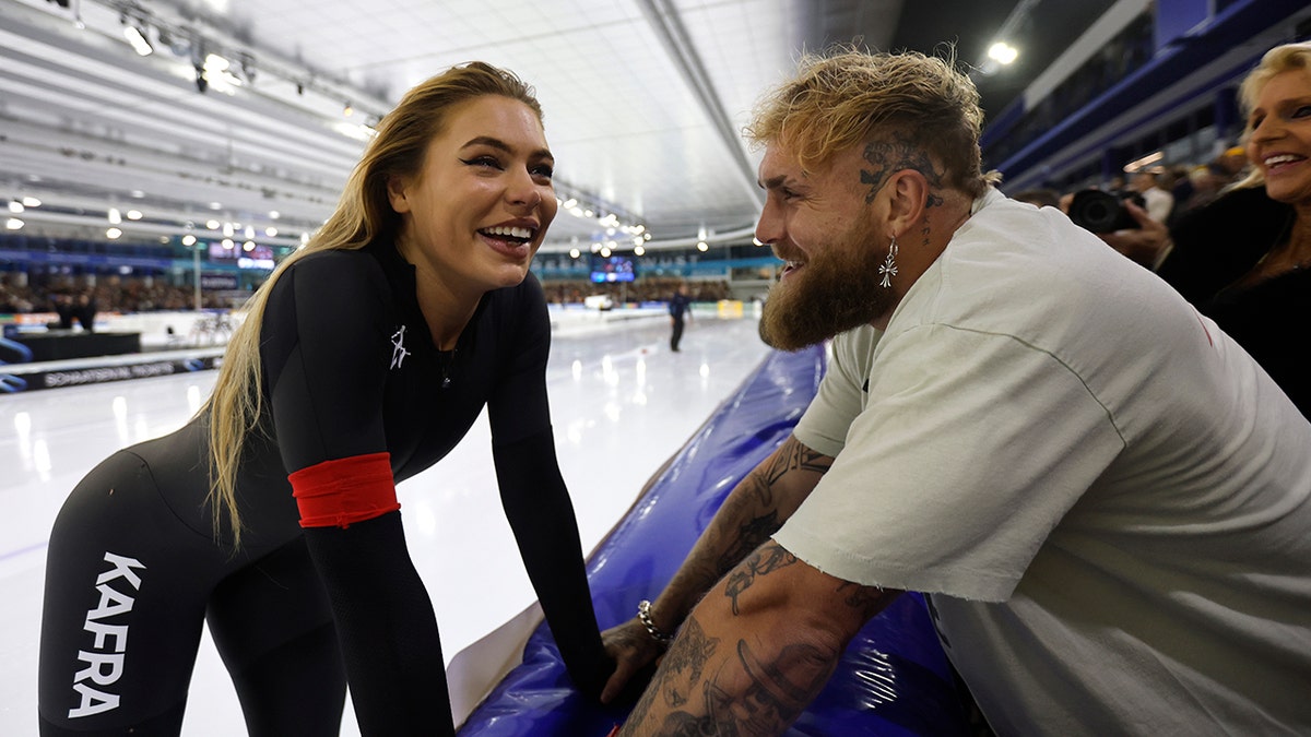 Jutta Leaddam and Jake Paul interact