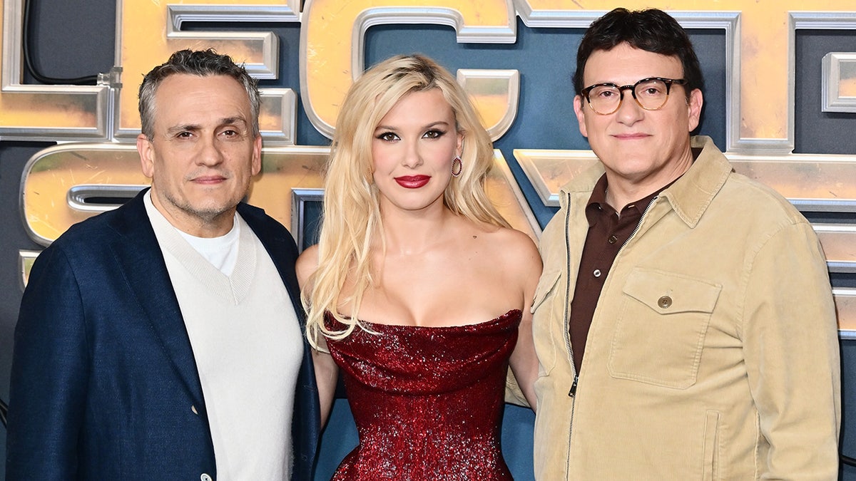 Joe Russo, Millie Bobby Brown and Anthony Russo posing on the red carpet