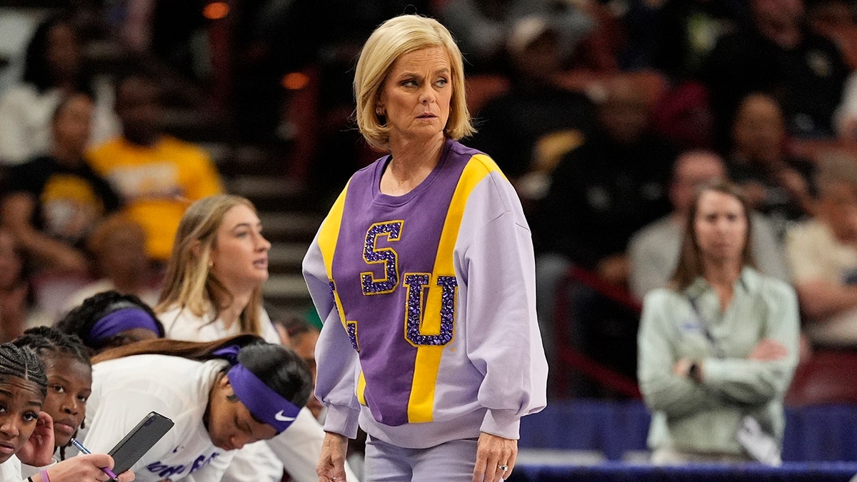 Kim Mulkey looks on