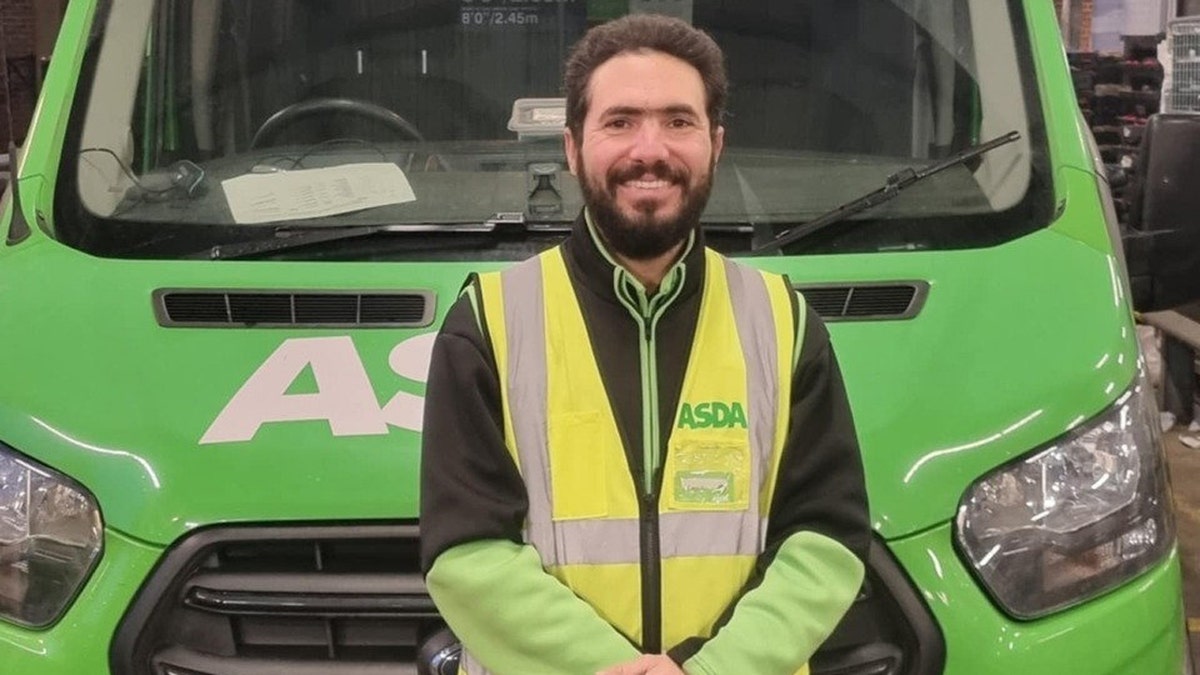 Leandro Pinta Dantas is shown in front of his delivery vehicle.