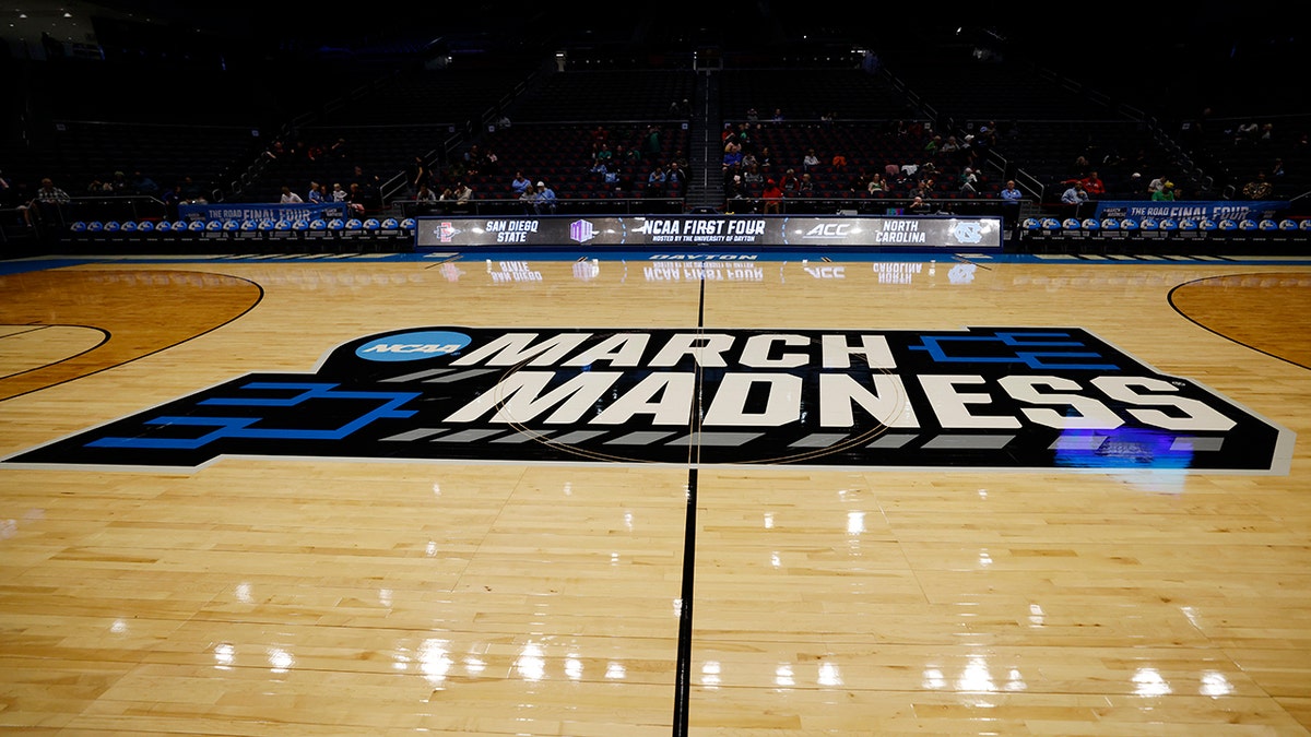 March Madness logo on court