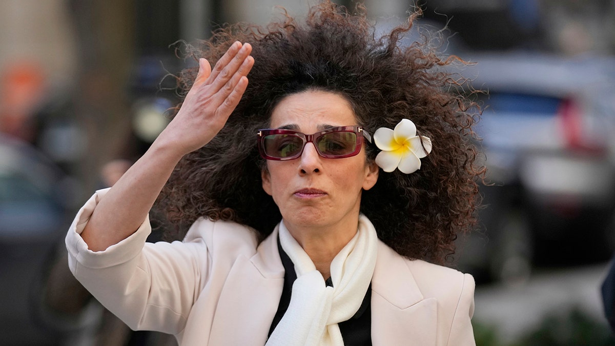 Masih Alinejad waving outside the federal courthouse