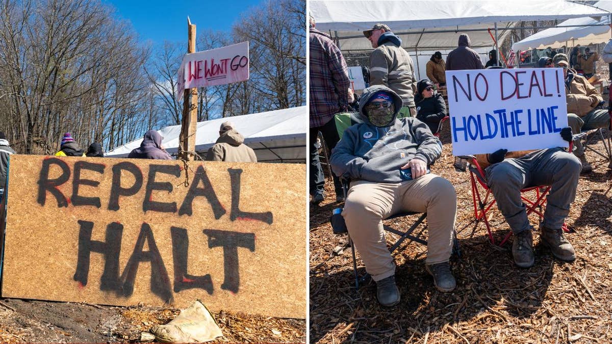 Prison guard strikers with protest signs