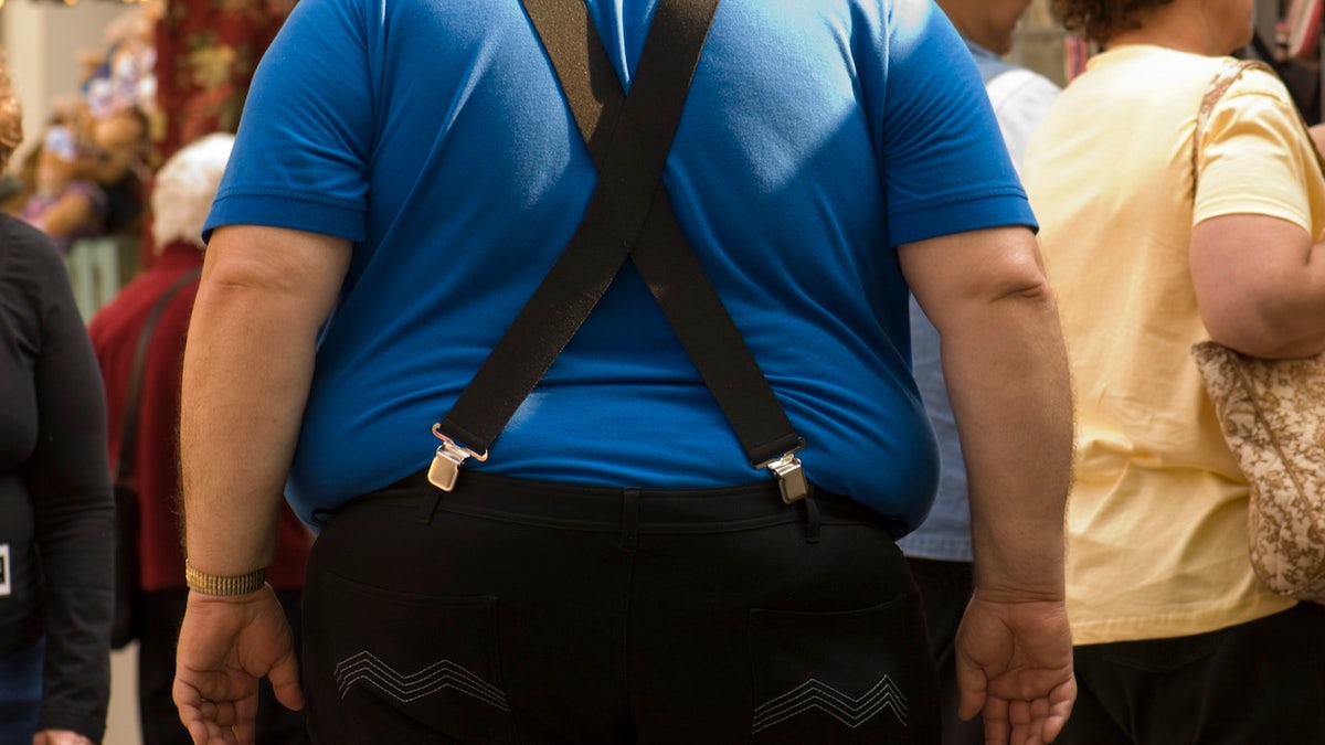 Obese man walking