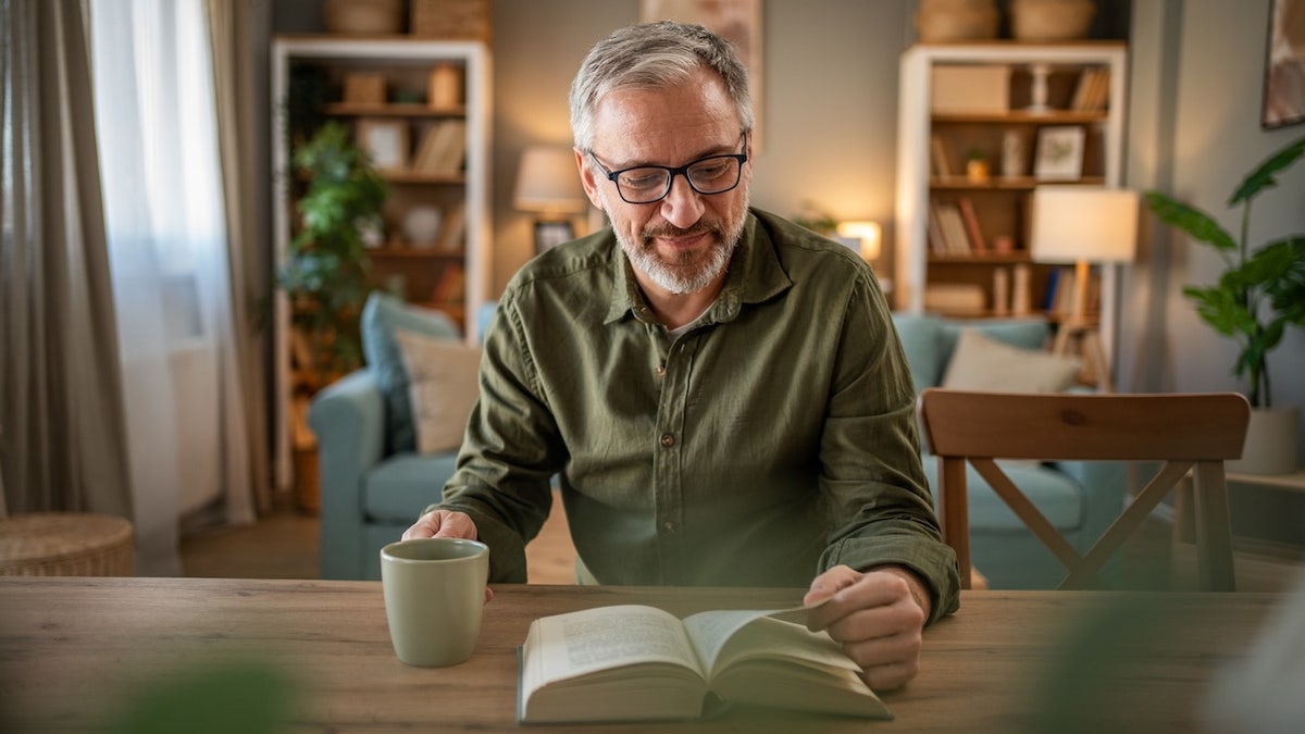 Older man reading book