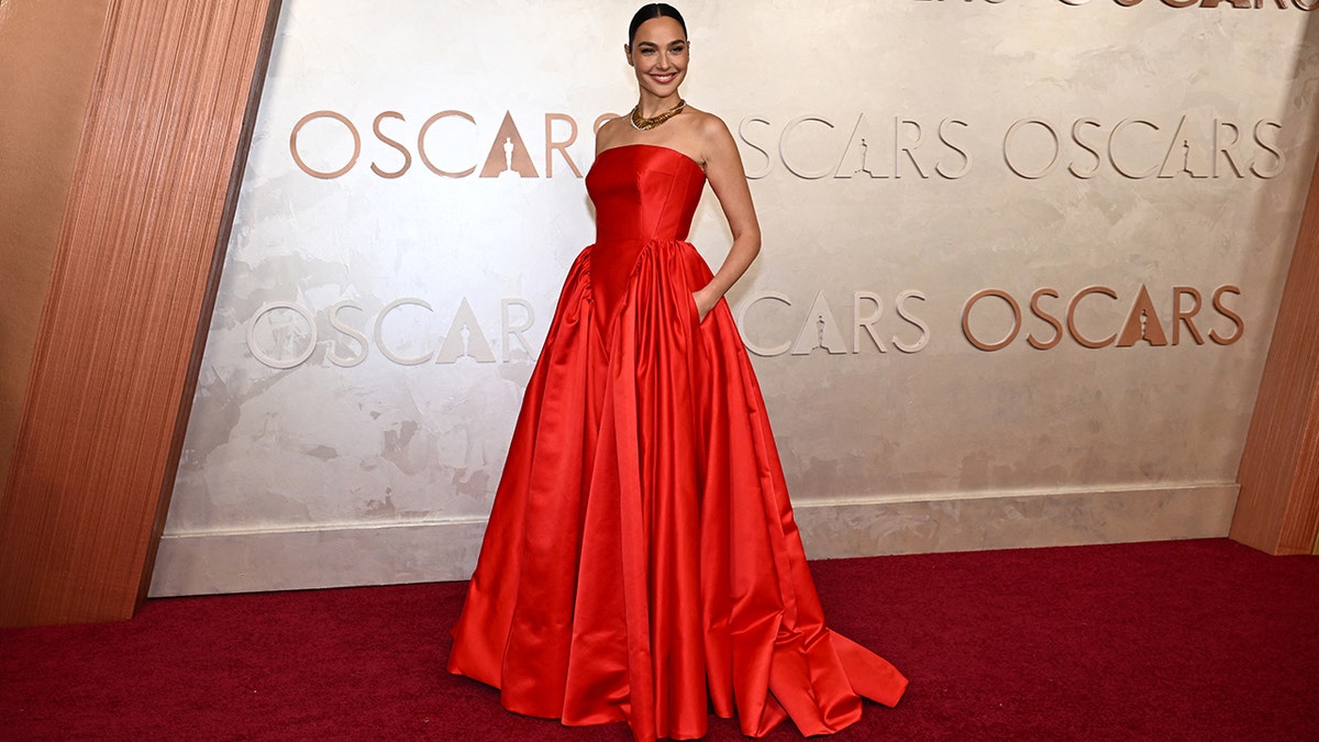 Gal Gadot looked stunning in an orange ballgown.