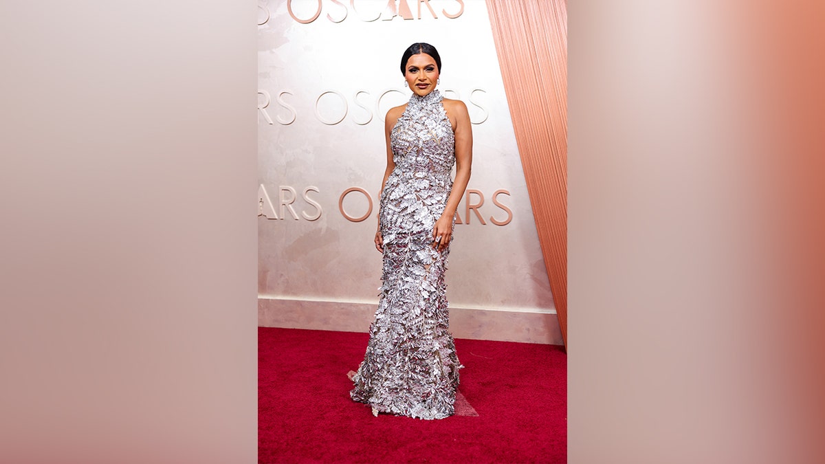 Mindy Kaling glittered on the red carpet in a silver sequined gown.