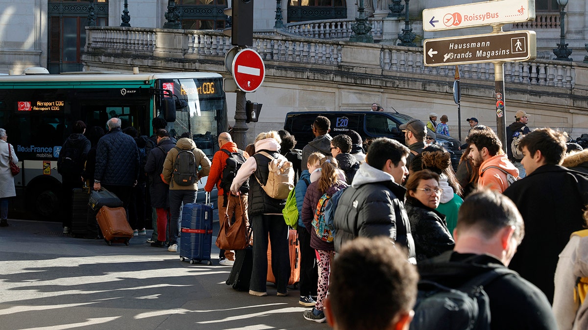 Lining up for bus in Paris