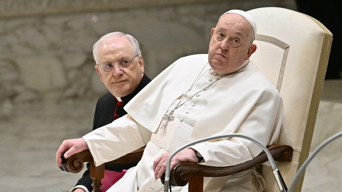 Pope sits on a chair