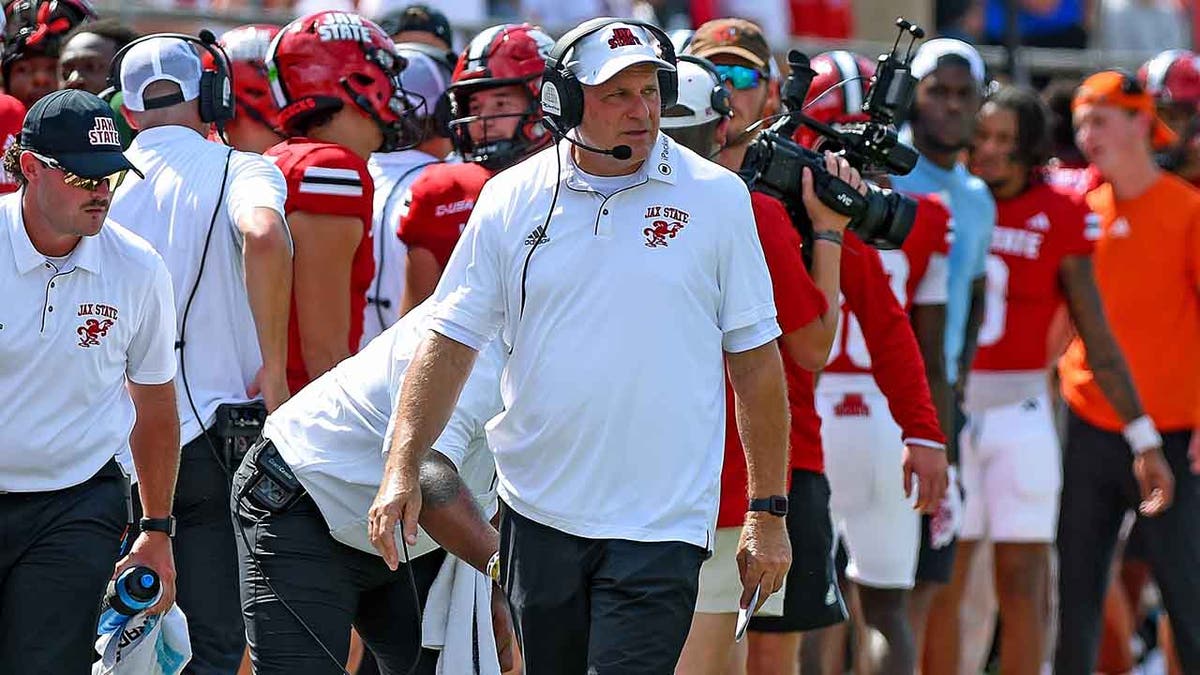 Rich Rodriguez looks on