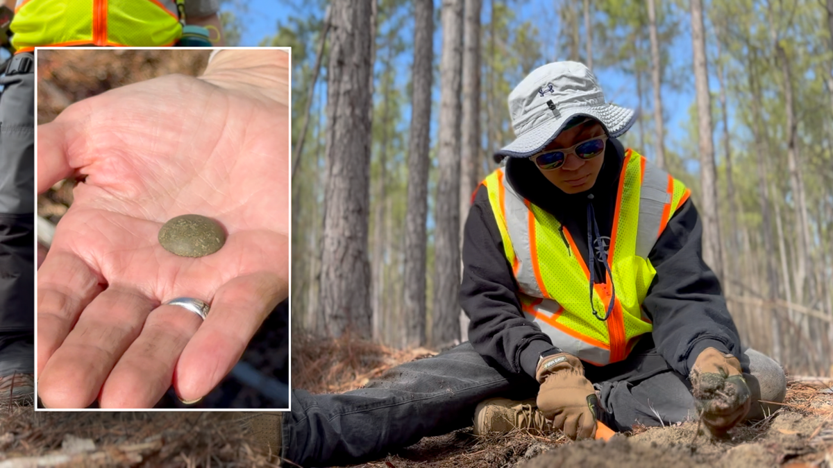 A button is found as veterans dug at Camden Battlefield in South Carolina.