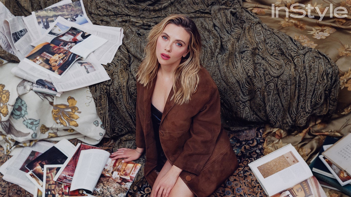 Scarlett Johansson sitting in front of a tree for instyle magazine