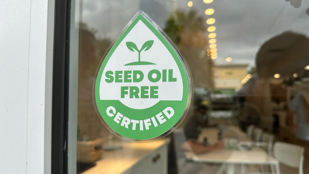 Seedless oil certification seal forms on the front door of the Garden Butcher in Boca Raton, Florida.