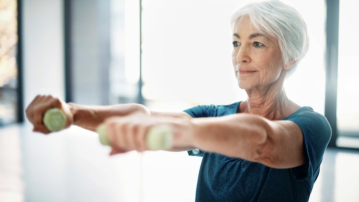 Older woman lifting weights