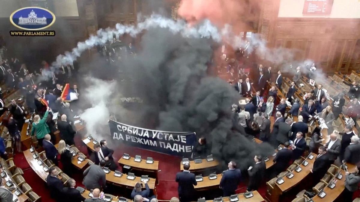 Serbian opposition legislators left smoke bombs 