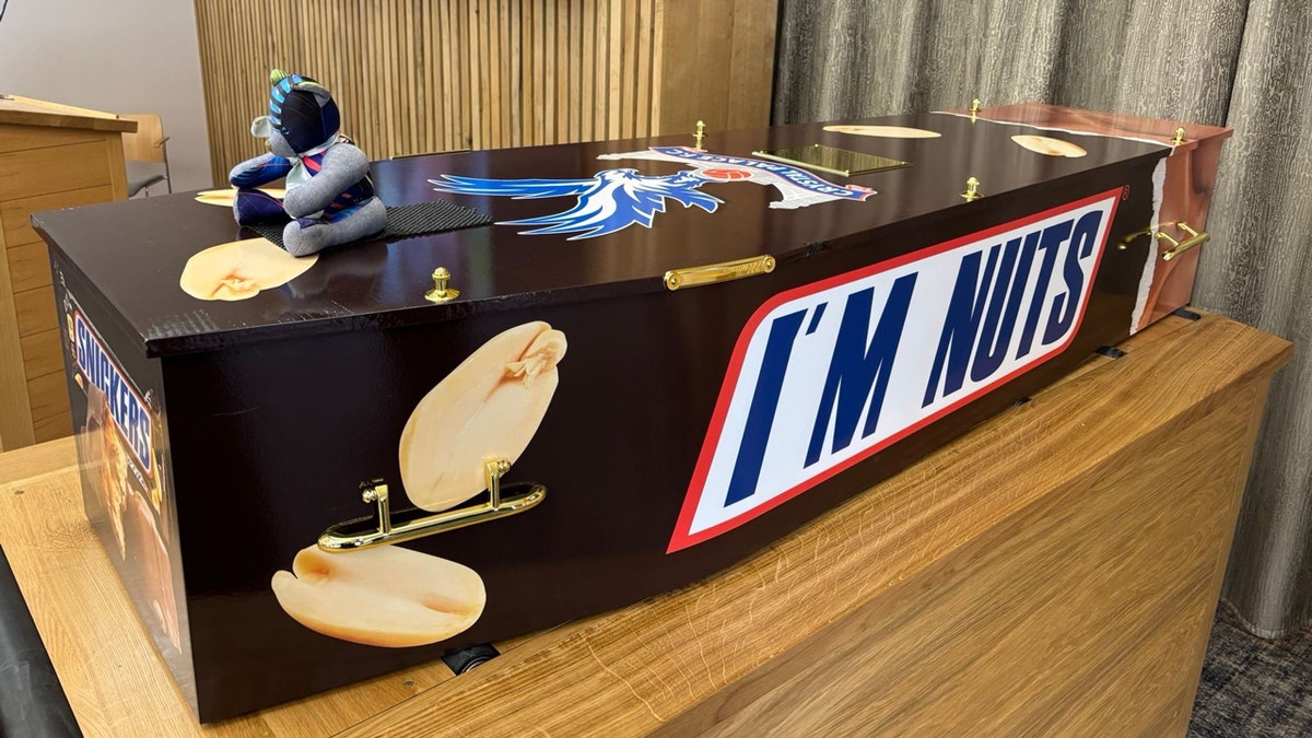 Paul Broome's Snickers-themed coffin included a message made to look like the candy bar's logo: "I'm nuts."