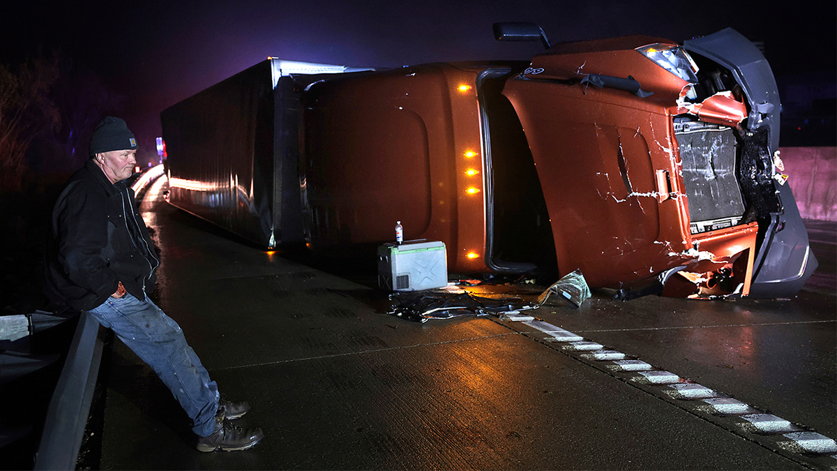 Mark Nelson, from Wisconsin, waits with his tractor-clear