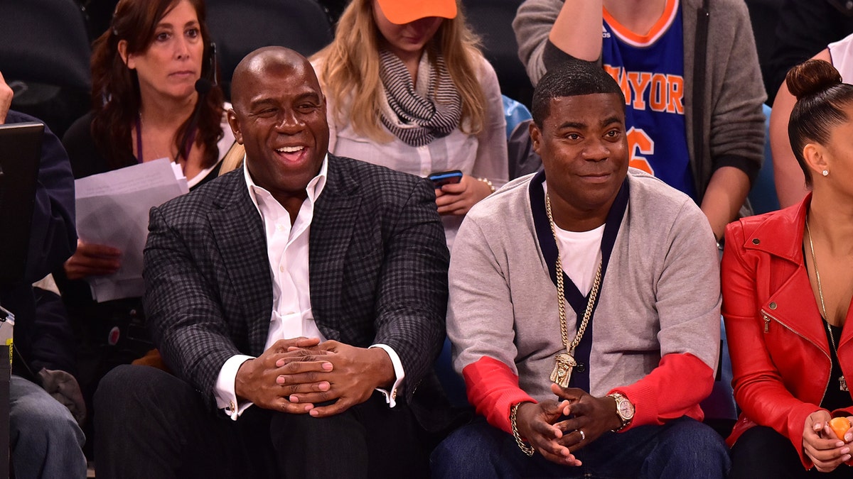 Magic Johnson and Tracy Morgan attend a Knicks game