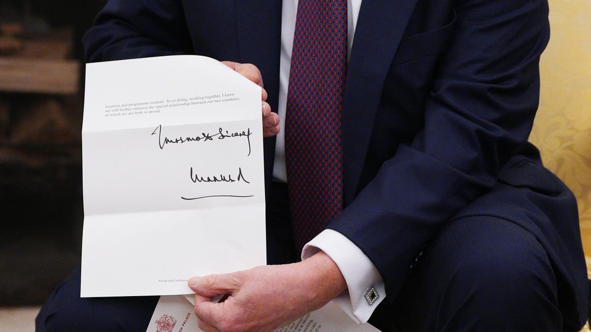 King Charles letter holding Trump