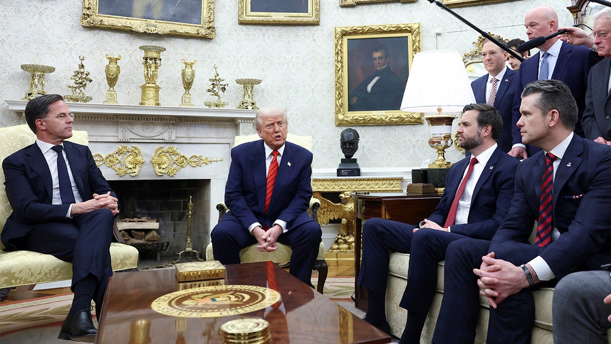 President Donald Trump reacts when he meets NATO Secretary Mark Root