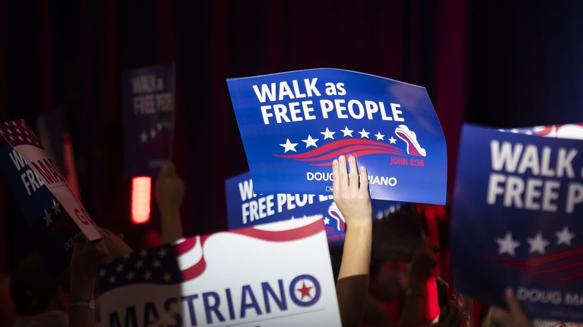 Walk as Free People signs