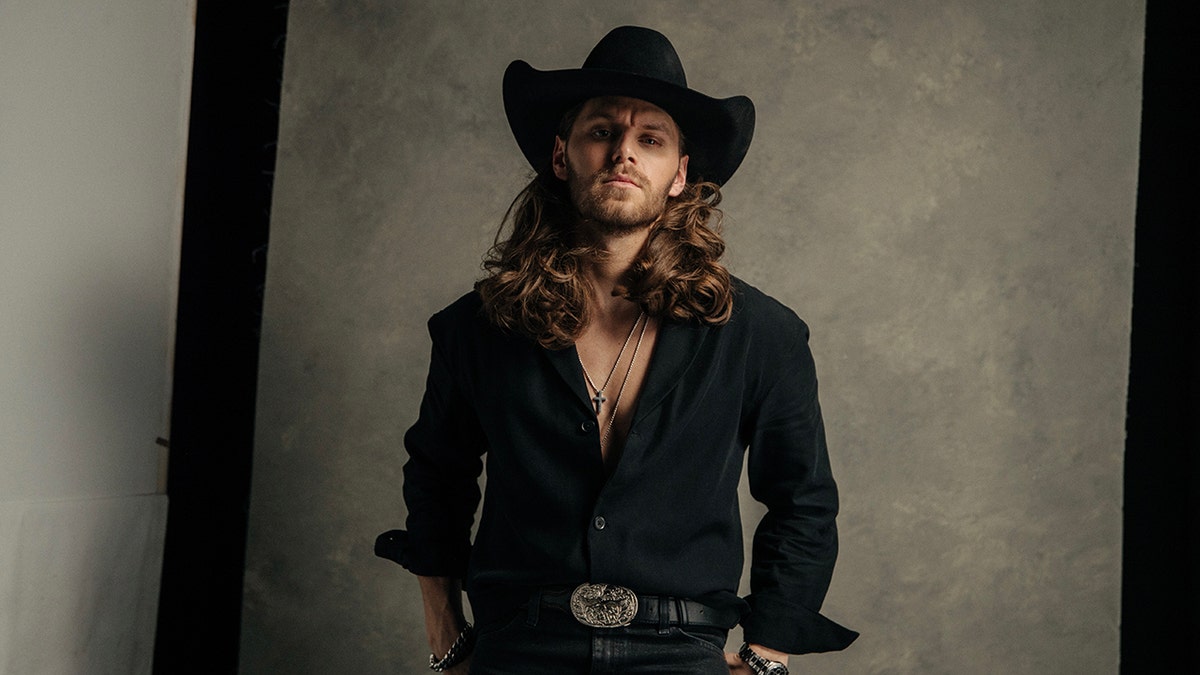 Warren Zeiders studio portrait wearing all black