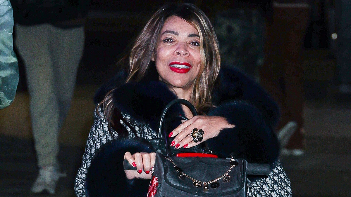 Wendy Williams uses a blue dior coat in New York.