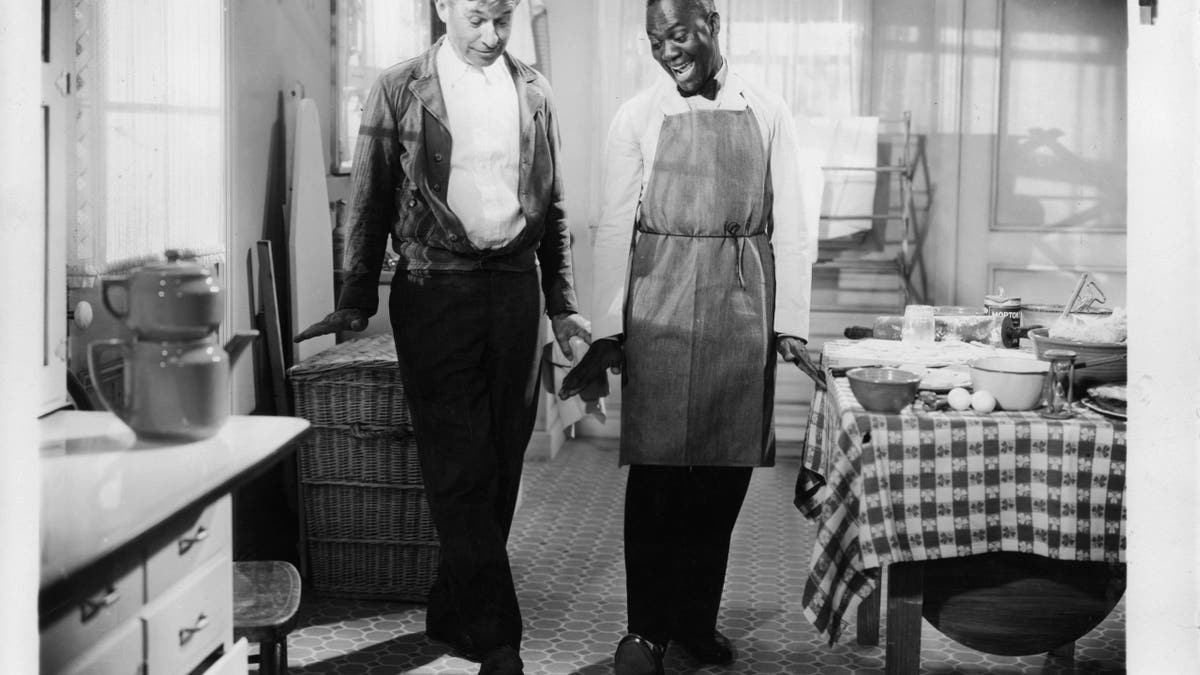 Will Rogers in a movie scene with Bill Robinson