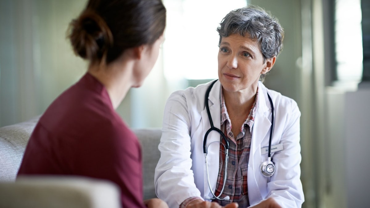 Woman receiving a diagnosis