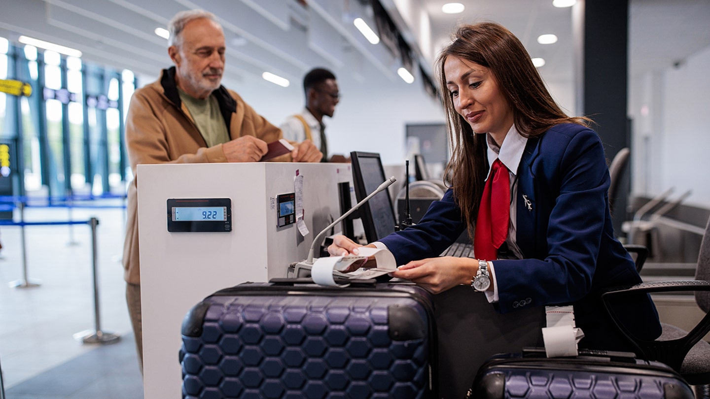 man checking bag at airport