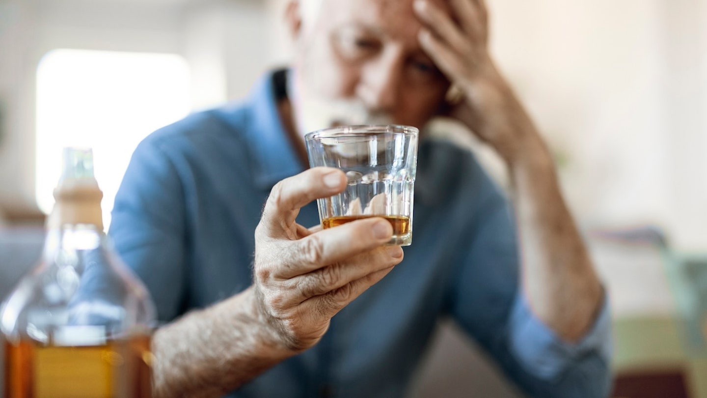 man drinking liquor