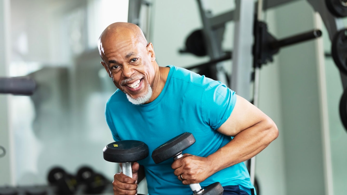 man lifting weights